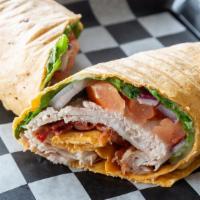 Turkey Club Wrap · Turkey and bacon with lettuce, tomato and red onion with ranch dressing in a tortilla wrap. ...