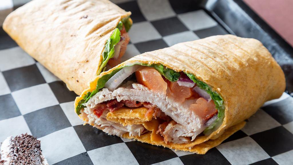 Turkey Club Wrap · Turkey and bacon with lettuce, tomato and red onion with ranch dressing in a tortilla wrap. Choose from white, tomato, spinach, or a low carb tortilla.