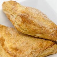 Apple Turnover · A puff pastry triangle filled with sliced apples and cinnamon.