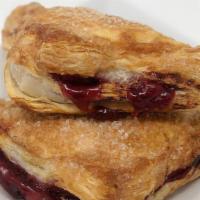 Cherry Turnover · A puff pastry triangle stuffed with delicious cherries just for your delight!