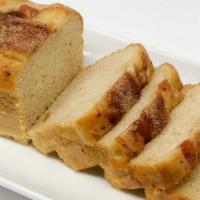 Apple Cinnamon Bread · A loaf of our moist quickbread with apples and cinnamon baked throughout. A great morning br...