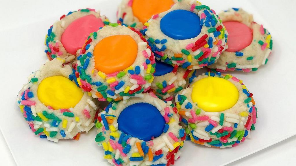 Thumbprint Cookie · The most popular cookie in the whole bakery! A shortbread cookie thats rolled out and pressed with your thumb to allow for a dollop of sweet icing in the center! Always a festive colorful treat to have on your table!