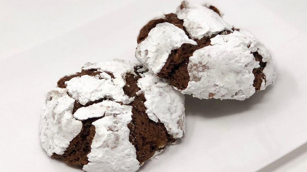 Chocolate Krinkle Cookie · A chocolate brownie like cookie with pecans and then rolled in powdered sugar. Simply delightful!