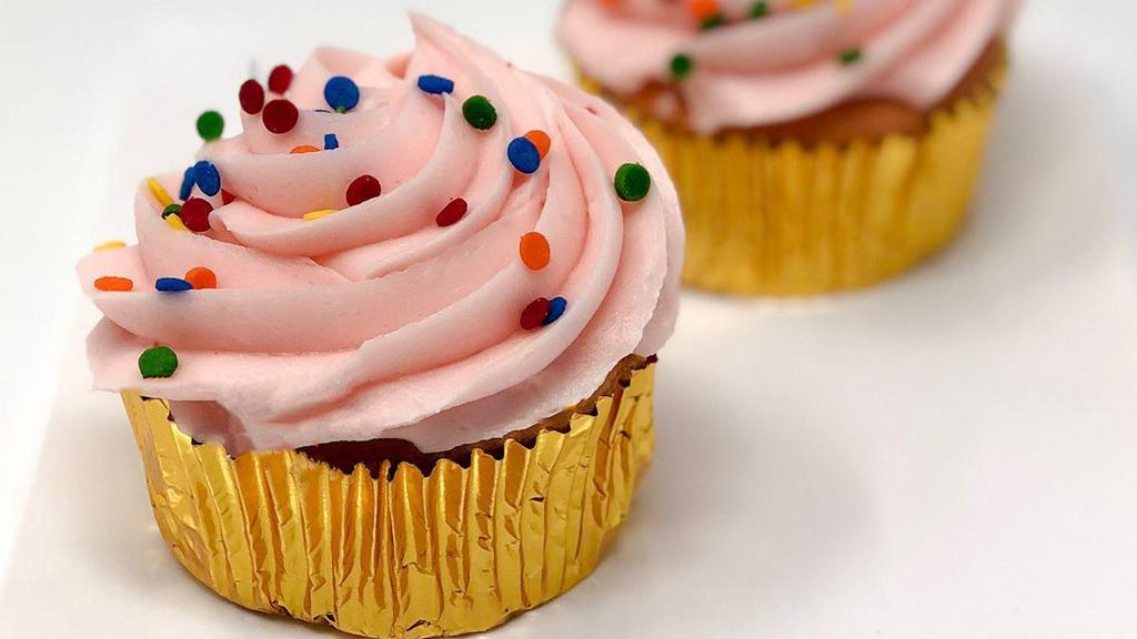 Sprinkled Cupcake - Strawberry · A delicious strawberry cupcake with strawberry buttercream icing. Topped with seasonal sprinkles!