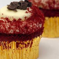 Southern Red Velvet Cupcake · Our southern red velvet cake with cream cheese icing topped with decadent chocolate curls.