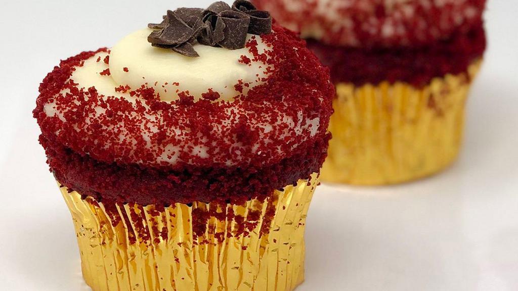 Southern Red Velvet Cupcake · Our southern red velvet cake with cream cheese icing topped with decadent chocolate curls.