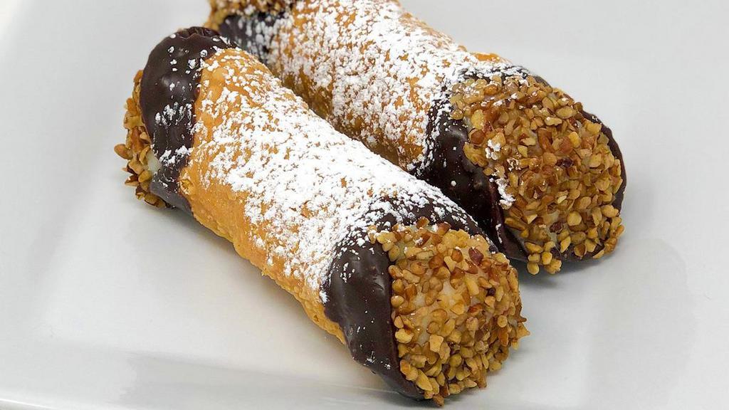 Cannoli · Crispy shell filled with sweetened cream cheese with both ends dipped in chocolate and pecans. Just like they have in New York!