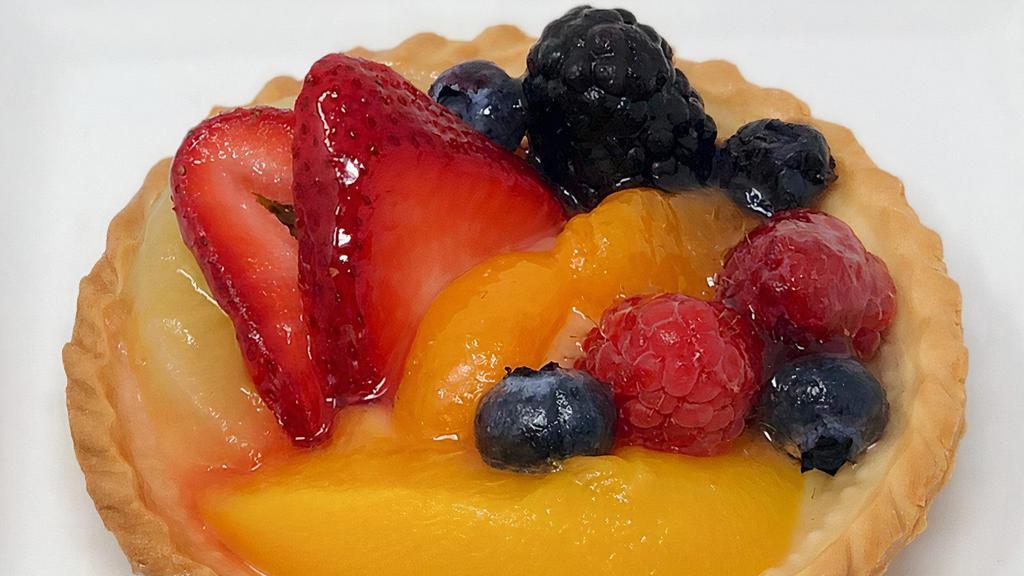 Fruit Tart · Small pie shell with custard filling topped in fresh fruit and an apricot glaze. These are real colorful treat to have at brunches and showers, plus the taste delicious!