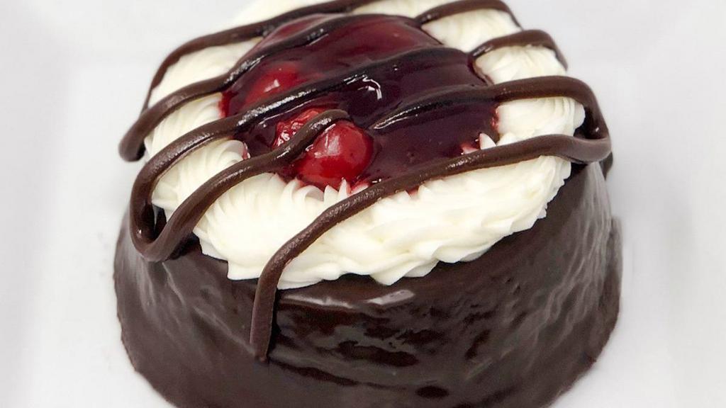 Black Forest Miniature · Chocolate cake covered in our chocolate ganache and topped with cherries.