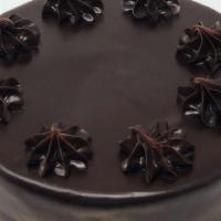 Ganache Cake · 2 layers of chocolate cake with raspberry filling and ganache icing, also available in a 6