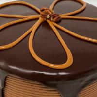 Turtle Dessert Cake · Chocolate cake with chocolate and caramel filling iced in chocolate buttercream topped with ...