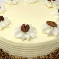 Carrot Cake · 2 layers of our carrot cake made with pecans and pineapple filled with vanilla cream and ice...