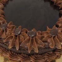 Chocolate Cheesecake · Rich chocolate flavored New York style cheesecake with ganache on top. Have us put some some...