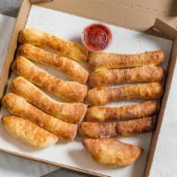 Garlic Parm Dough Stix (12Pc) · Freshly baked bread topped with butter, garlic & parmesan romano. Served with pizza sauce side