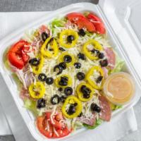 Large Antipasto · Lettuce, ham, salami, tomato, black olives, banana peppers, topped with our mozzarella. Serv...