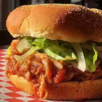 Bbq Chicken Thigh Sandwich · Dark meat, sweet BBQ, lettuce, and onions on a kaiser bun.