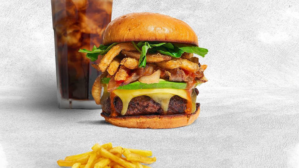 French Fries Burger · American beef patty topped with fries, avocado, caramelized onions, ketchup, lettuce, tomato, onion, and pickles.