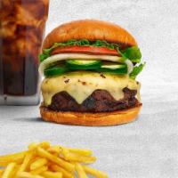 Jalapeno Burger · American beef patty topped with melted cheese, jalapenos, lettuce, tomato, onion, and pickles.