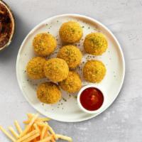 Mac & Cheese Balls · (Vegetarian) Bite-size clumps of mac and cheese breaded and fried until golden brown. Served...