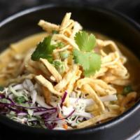 Curry Ramen · Choice of chicken or tofu yellow curry soup, red onions, cabbage, carrot, crispy noodles, ci...