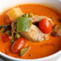 Duck Curry · BBQ duck, tomato, pine apple, bell pepper and Thai red curry simmered with coconut milk.