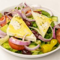 American Greek Salad · Tomatoes, cucumbers, kalamata olives, pepperoncinis, red onions and feta cheese laid out on ...