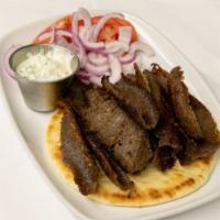 Gyro Platter · Succulent lamb and beef with classic Greek spices served with tomatoes, onions, tzatziki sau...