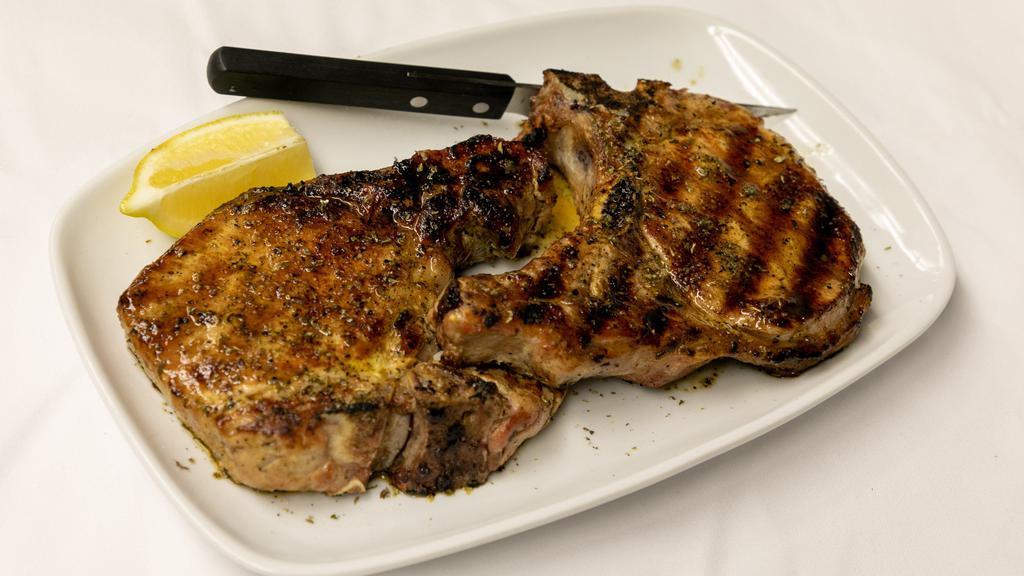 Pork Chops · Bone in pork chop finished with our special herb oil. Served with your choice of two sides. Consuming raw or undercooked meats, poultry seafood, shellfish or eggs may increase your risk of foodborne illness, especially if you have a certain medical conditions.