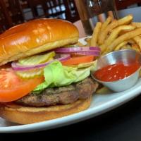 Taxi'S Burger · Fresh ground beef, lettuce, tomato, onion, pickle, on a brioche bun.
