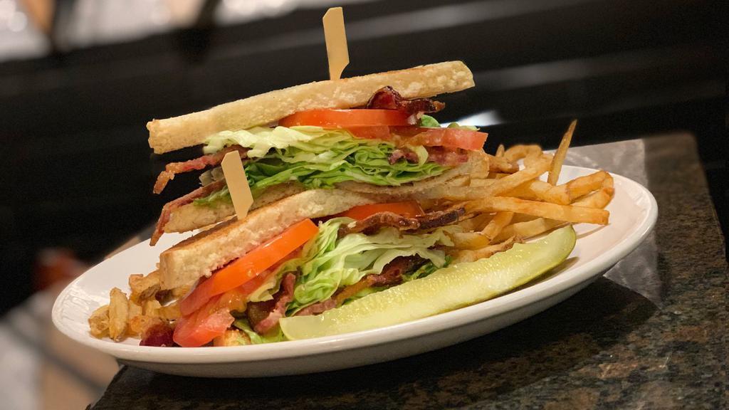 Blt · Thick cut pecan smoked bacon, butter lettuce, tomato, mayo, on toasted sourdough.
