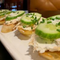 Smoked Salmon Toast · House smoked salmon, herbed cream cheese, capers, cucumber, chives, horseradishes, remoulade.