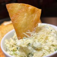 Artichoke-Spinach Dip · Spinach, Artichoke Hearts and Monterey Jack 
with Tortilla Chips