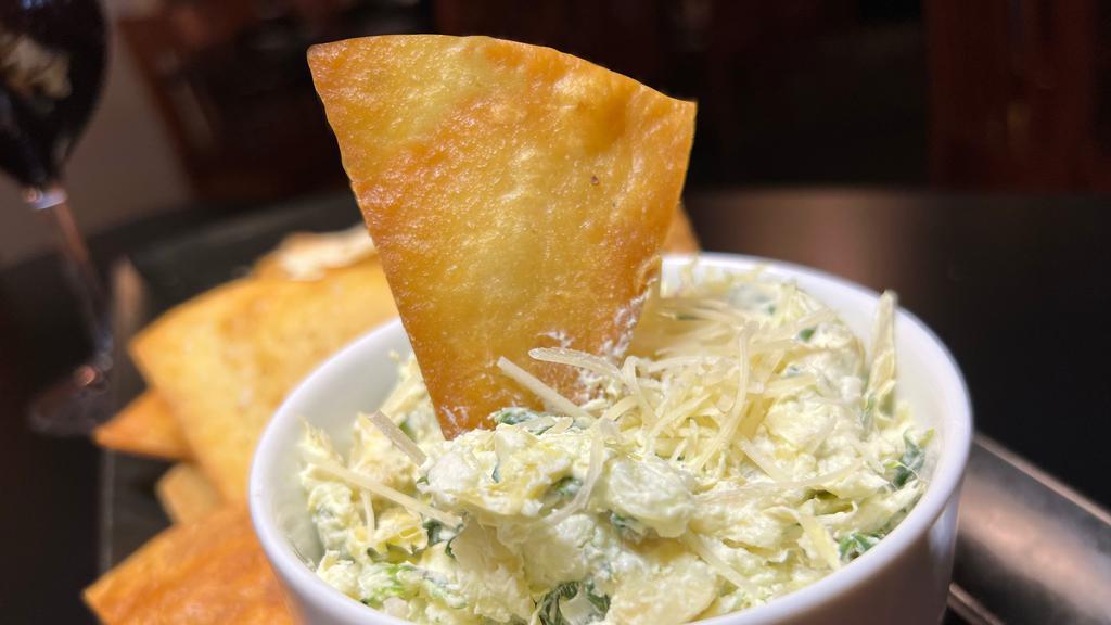 Artichoke-Spinach Dip · Spinach, Artichoke Hearts and Monterey Jack 
with Tortilla Chips