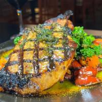 Pork Chop · Soy and Ginger Marinated Pork Chop on a Red Pepper and Sweet Potato Hash, 
Cilantro Pesto, B...