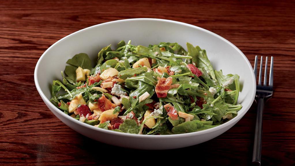 Smoked Bacon Arugula Salad  · Baby arugula, toasted slivered almonds, Gorgonzola cheese, oven-dried apples & smoked bacon served with housemade honey-sherry vinaigrette (170 cal)