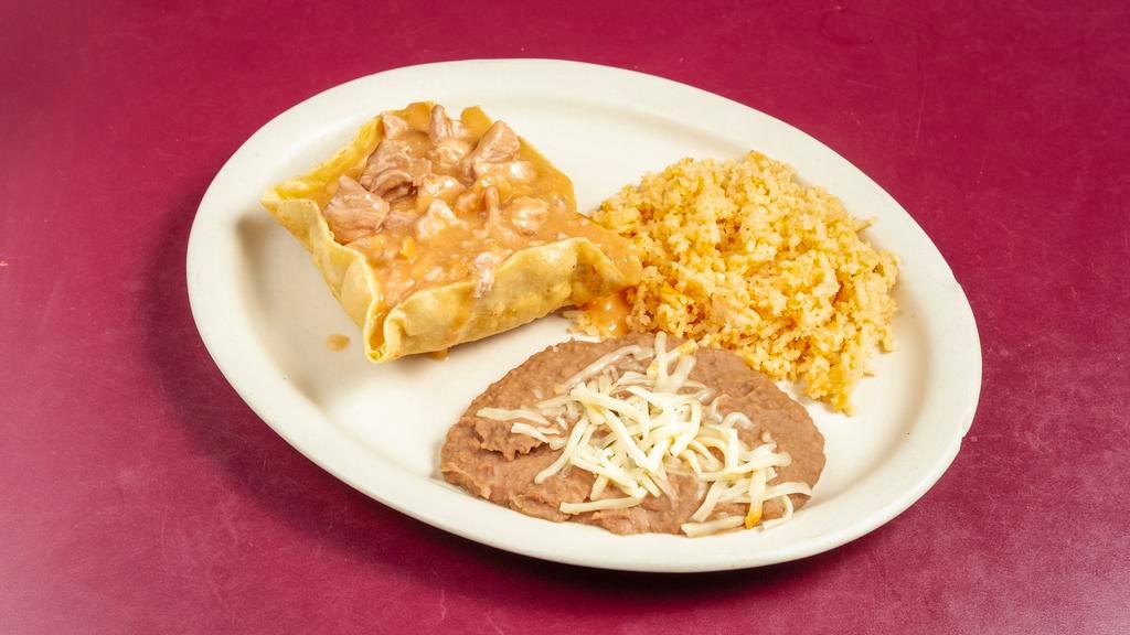 Mexican Special (Mild) · Chile verde chunks of pork in a mild gravy, served in a deep fried tortilla bowl with beans, rice and tortillas.