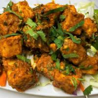 Smacki'N Chili Paneer · Fried Indian cottage cheese sautéed with onions, bell peppers, spices, chilies and herbs.
