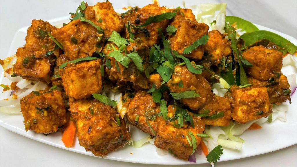 Smacki'N Chili Paneer · Fried Indian cottage cheese sautéed with onions, bell peppers, spices, chilies and herbs.