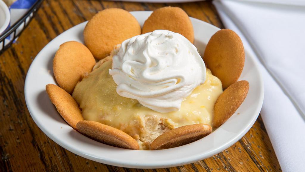 Banana Pudding · Made from scratch pudding with vanilla wafers and finished off with a creamy whipped topping.