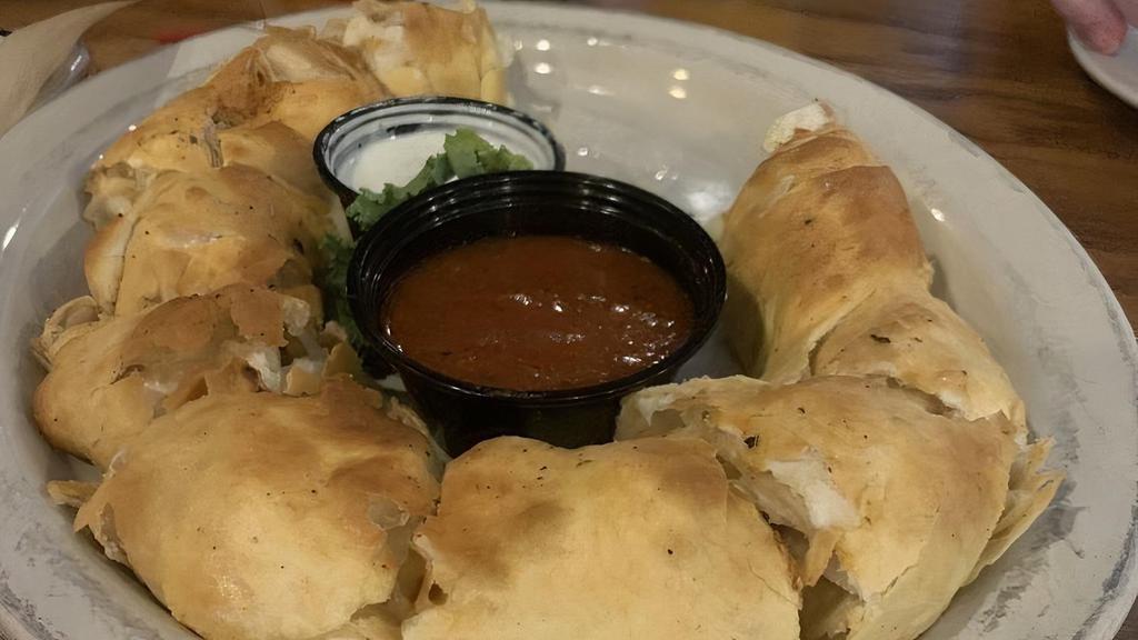 Bones · Fresh hand rolled pizza dough stuffed with mozzarella and baked to perfection. Served with marinara and ranch.