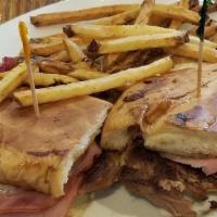 Konrad'S Cuban · Sweet ham, roast pork, melted swiss cheese, house spicy mustard, and pickles, lightly presse...