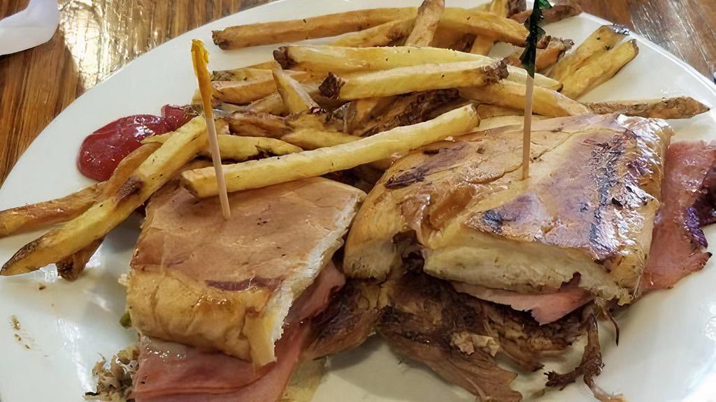 Konrad'S Cuban · Sweet ham, roast pork, melted swiss cheese, house spicy mustard, and pickles, lightly pressed, and grilled on Cuban bread.