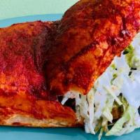 Pambazos · Torta bread dipped and fried in a red guajillo pepper sauce and stuffed with chorizo & papas...