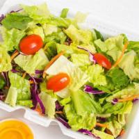 Garden · Freshly cut tomatoes, crisp romaine lettuce and your choice of one of our signature dressings.