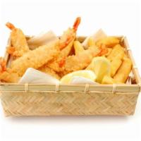 Shrimp Basket · Crispy golden shrimp served with a side of french fries and tangy Buffalo sauce.