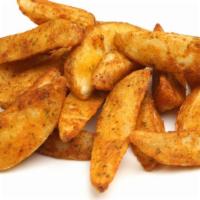 Spicy Potato Wedges · Hearty potato wedges dusted with ground spices.