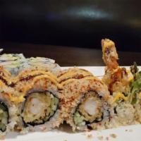 Crunch Roll · Inside shrimp tempura, cucumber, kaiware inside, topped with crunch masago and nori fumi.