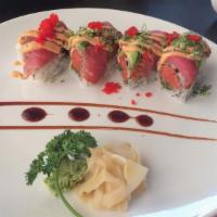 Dancing Tuna Roll · Inside spicy tuna and asparagus, outside with pepper tuna, avocado, spicy mayo, scallions an...