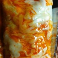 Pork Burrito Spread · Beans with pork in red chile sauce topped with red chile and melted cheese.