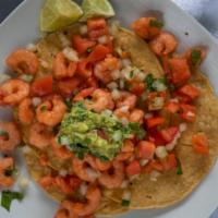 Shrimp Ceviche · Shrimp mixed with lime pico, and avocado. Served with three tostada shells.